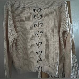 Cute sweater it goes up to your waist